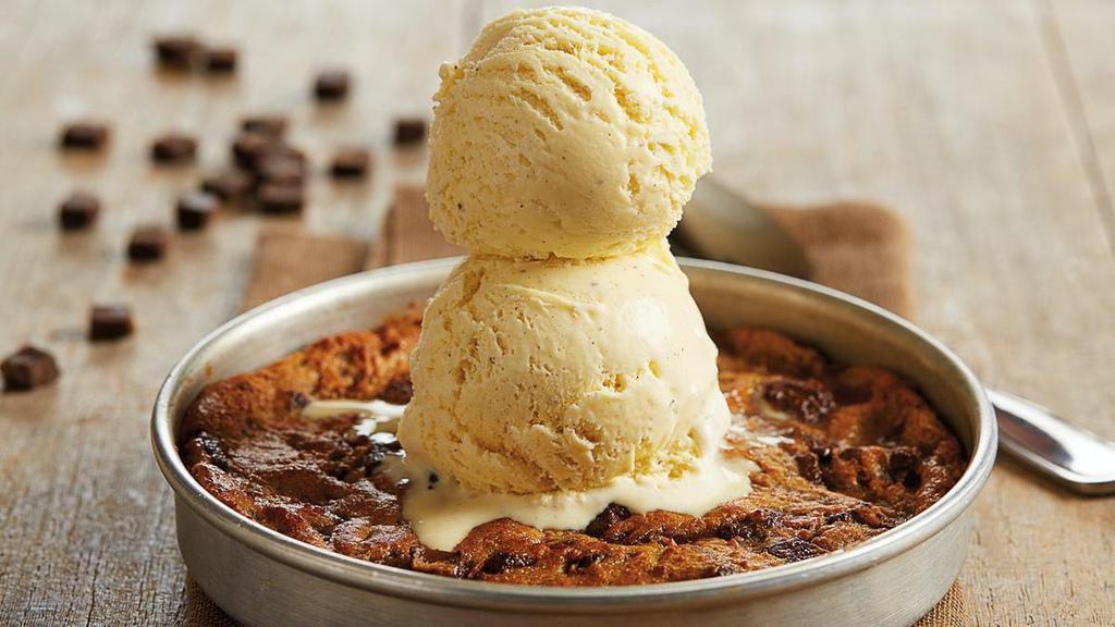 Bj'S Chocolate Chunk Pizookie® · Dive into this ooey, gooey, fresh-baked chocolate chunk cookie topped with two scoops of our rich vanilla bean ice cream.