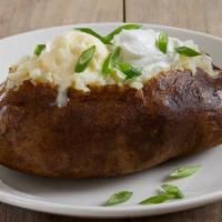 Baked Potato · Served with butter, sour cream and green onions on the side.