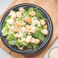 Caesar · Crisp romaine lettuce topped with specially seasoned croutons, premium shredded Parmesan che...