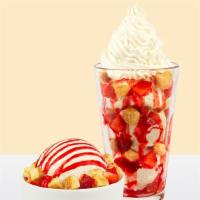 Strawberry Bond™ · Vanilla bean ice cream, cheesecake bites, strawberry sauce, fresh strawberries.