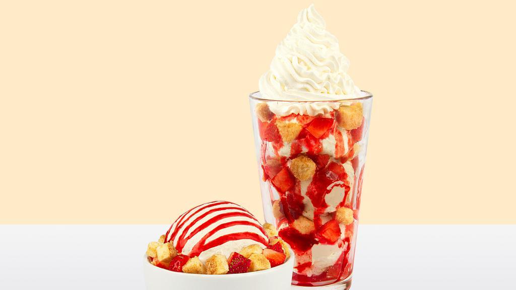 Strawberry Bond™ · Vanilla bean ice cream, cheesecake bites, strawberry sauce, fresh strawberries.