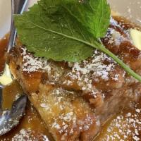 House Bread Pudding · Favorite. Served warm with a whisky caramel sauce.