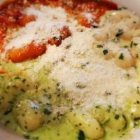 Gnocchi Tricolore · Homemade potato dumpling served with a trio of pesto cream, Gorgonzola and marinara sauces.
