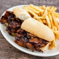 Bbq Tri Tip Sandwich · Thinly sliced, caramelized BBQ sauce, on a toasted baguette