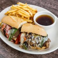 Western Tri Tip Sandwich · Montery jack, sautéed onions & peppers, real au jus, toasted baguette.