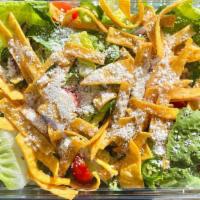 Zesty Caesar Salad · Romaine lettuce, cotija cheese, cherry tomatoes, pumpkin seeds, sliced serranos, cilantro, t...