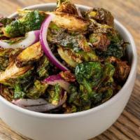 Fried Brussels Sprouts · Fried brussels, slivers of red onions, salt & pepper and tossed in a honey balsamic glaze