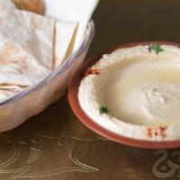 Hummus · Gluten-free. A delicious Middle Eastern blend of garbanzo beans tahini, fresh garlic, lemon ...