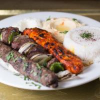 Shish Kebab Mix Entree · Three skewers of chicken, koufta and lamb served with basmati rice or bourghol, garlic sauce...