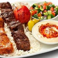 Combo Kabob Plate · Choose any combination of 2 different skewers (Chicken, Shish, or Lule). Garnished with a ro...