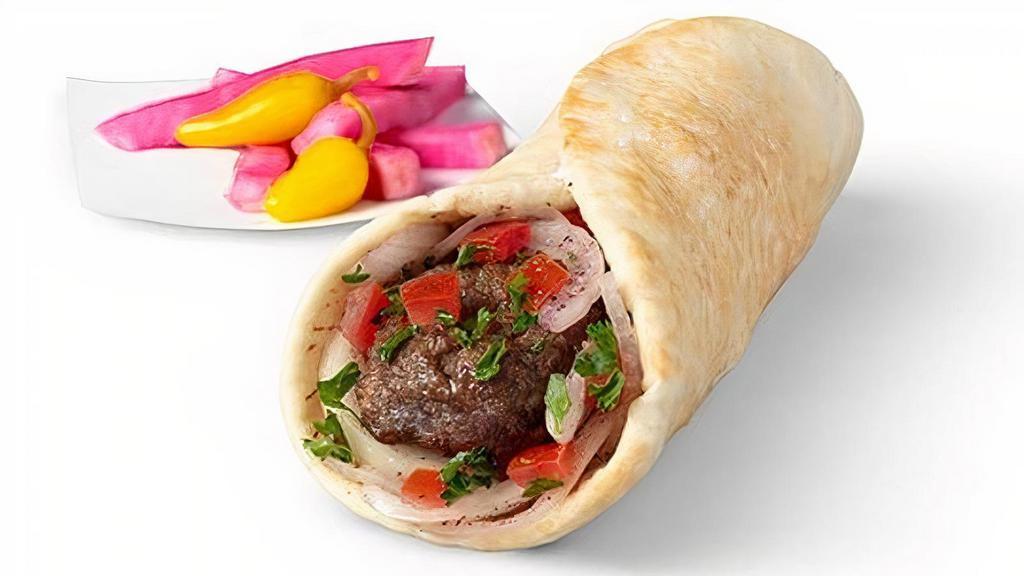 Lule Kabob Wrap · U.S.D.A. Choice beef seasoned with traditional herbs and spices, cooked to perfection , and topped with hand-diced tomatoes and spiced onions, wrapped in fresh pita bread. Served with Pickled Turnips and Yellow Chilies.