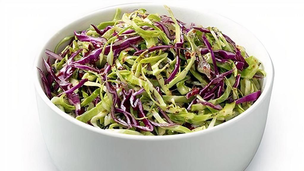 Cabbage Salad · Fresh and crisp red and green cabbage, mint and garlic, tossed with zesty lemon juice and olive oil