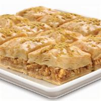 Baklava Tray · An indulgently sweet dessert! Nestled between its flaky and buttery layers is our family sec...