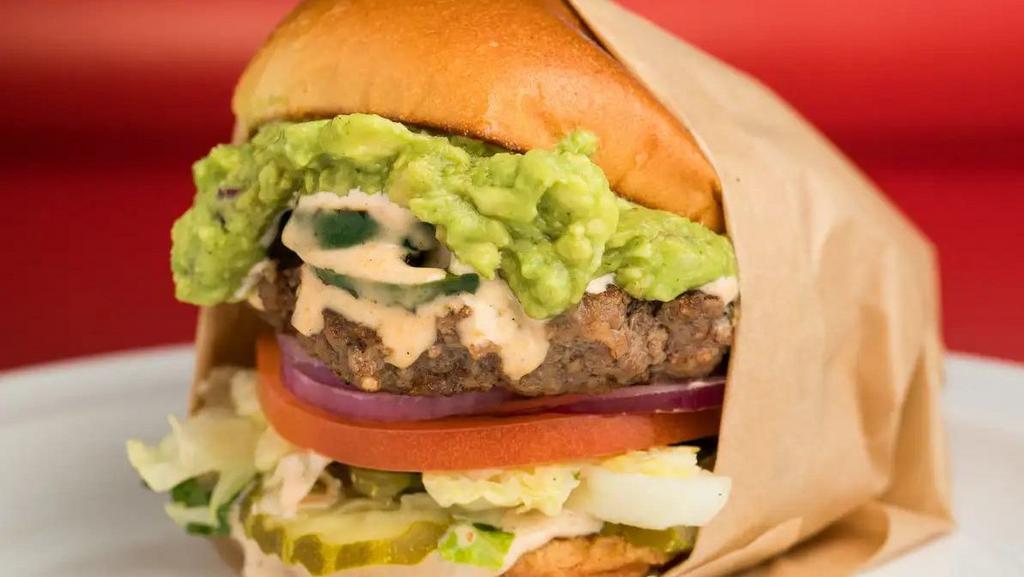 El Caliente · El Caliente Burger includes: 

100% fresh ground beef patty
Grilled Jalapenos
Fresh Guacamole
Spicy Chipotle Dressing
red onions, 
lettuce,
tomato, 
pickles, 
(lettuce wrap available upon request).