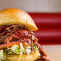 Colossal · The Colossal Burger includes: 

100% fresh ground beef patty
Topped with Pastrami
red onions...