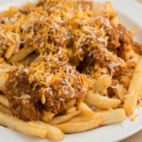 Chili Cheese Fries · Chili Cheese Fries include:

Homemade Chili,
Crispy Fries,
Shredded Monterey Jack and Chedda...