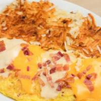 Ham & Cheese Omelet · Ham & Cheese Omelet includes: 

Ham, 
CA Fresh Eggs,
Shredded Monterey Jack and Cheddar  Che...