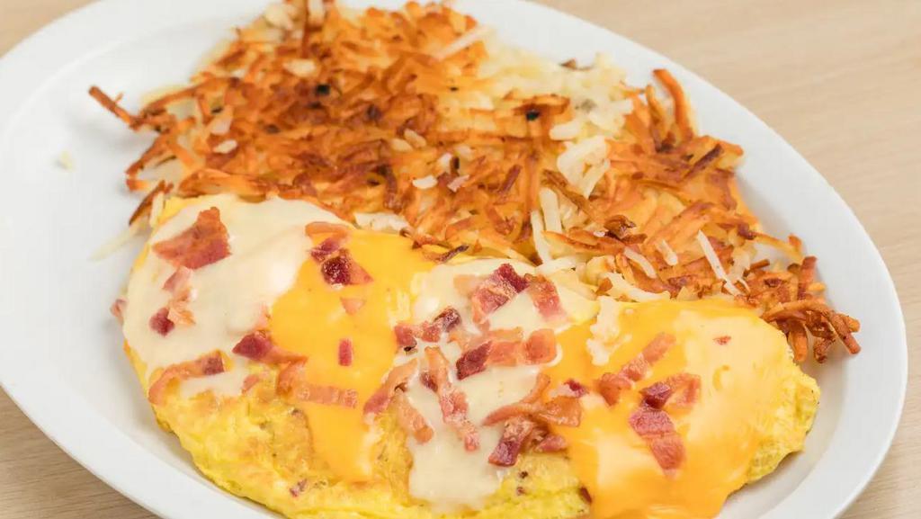Ham & Cheese Omelet · Ham & Cheese Omelet includes: 

Ham, 
CA Fresh Eggs,
Shredded Monterey Jack and Cheddar  Cheese

Crispy Hashbrowns
You choice of 2 slices of Toast. White, Wheat or Sourdough.