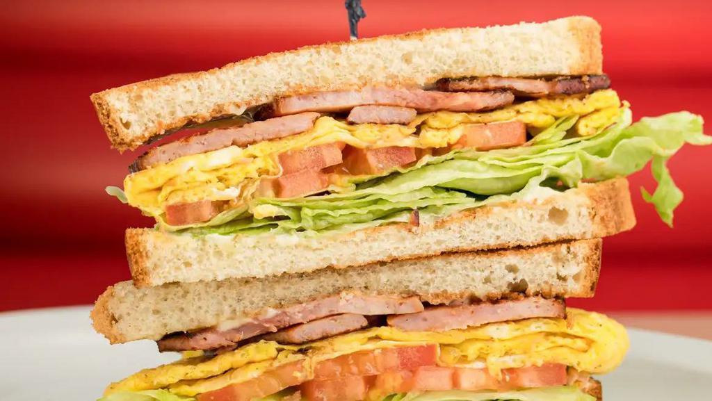 Ham & Egg Sandwich · Ham and Egg Sandwich includes: 

Ham Slices,
3 CA Fresh Eggs
Lettuce, 
Tomatoes,
Mayonnaise. 

Your Choice of Toast, White, Wheat or Sourdough.