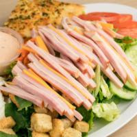 Chef Salad · Chef Salad Includes: 

Turkey 
Ham
American & Swiss Cheese
Romaine and Iceberg Lettuce mix
S...