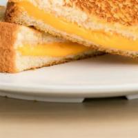 Grilled Cheese · Grilled Cheese includes: 

Grilled Sourdough Toast,
2 slices American Cheese.
2 slices Swiss...