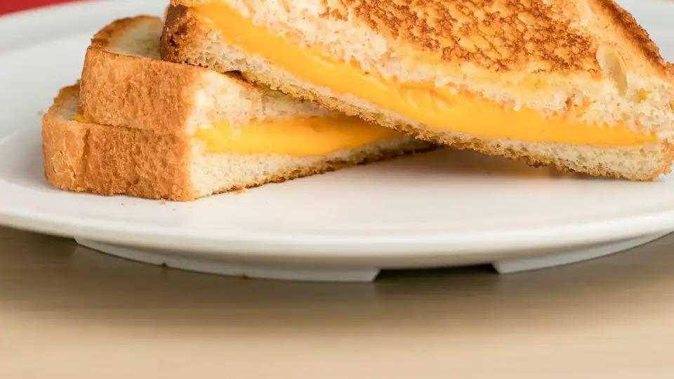 Grilled Cheese · Grilled Cheese includes: 

Grilled Sourdough Toast,
2 slices American Cheese.
2 slices Swiss Cheese