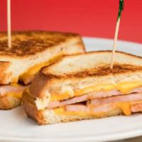 Grilled Ham & Cheese · Grilled Ham & Cheese includes: 

Grilled Sourdough Toast,
Ham Slices,
2 Slices American Chee...