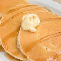 Pancakes · 3 Buttermilk Pancakes are served with Syrup and Butter.