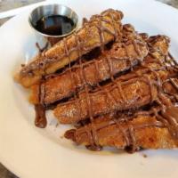 Sweet Battered Nutella French Toast · Battered French Toast slices topped with Nutella and whipped cream