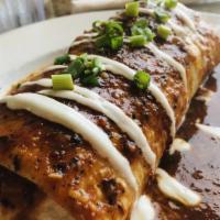Chorizo And Egg Burrito · Chorizo, scrambled eggs, bell pepper, hash browns and mushrooms wrapped in a giant flour tor...