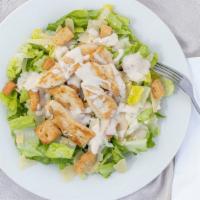 Chicken Caesar Salad · Grilled chicken, romaine, caesar dressing, Parmesan and croutons.