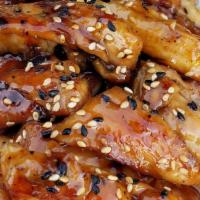 Kid’S Chicken Teriyaki · Grilled chicken thigh, glazed with teriyaki sauce, sesame seeds, served over rice.