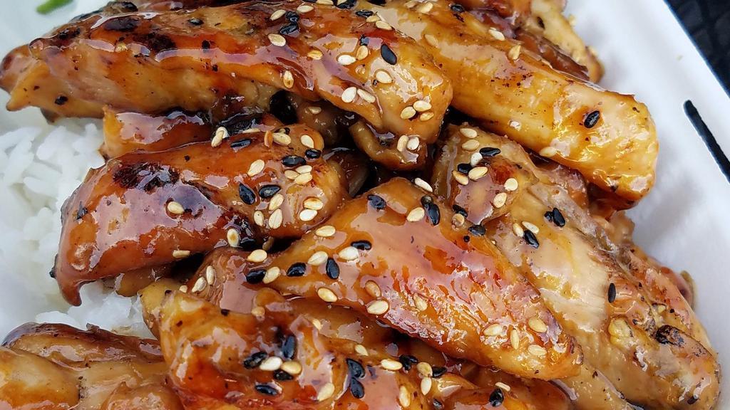 Teriyaki Chicken · Cooked. 
 Grilled chicken thighs, glazed with teriyaki sauce, sesame seeds, served over rice.
