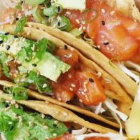 Salmon Poke Tacos (3 Tacos Per Order) · Raw. Sushi grade salmon poke, cabbage, green onions, toasted sesame seeds, spicy mayo topped...