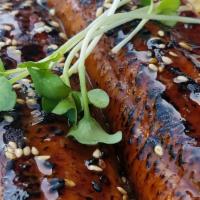Unagi Bowl · Cooked. 
 Roasted eel, glazed with sweetened soy, sesame seeds, served over rice.