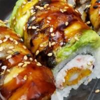 Dragon Roll · Cooked. Inside: imitation crab, panko shrimp.  On top: unagi (eel), avocado, sesame seeds.  ...