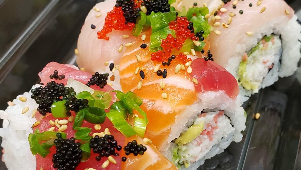 Rainbow Roll · Raw. Inside: imitation crab, avocado.  On top: 4 assorted fish, avocado, green onion, tobikko.  No Sauce.