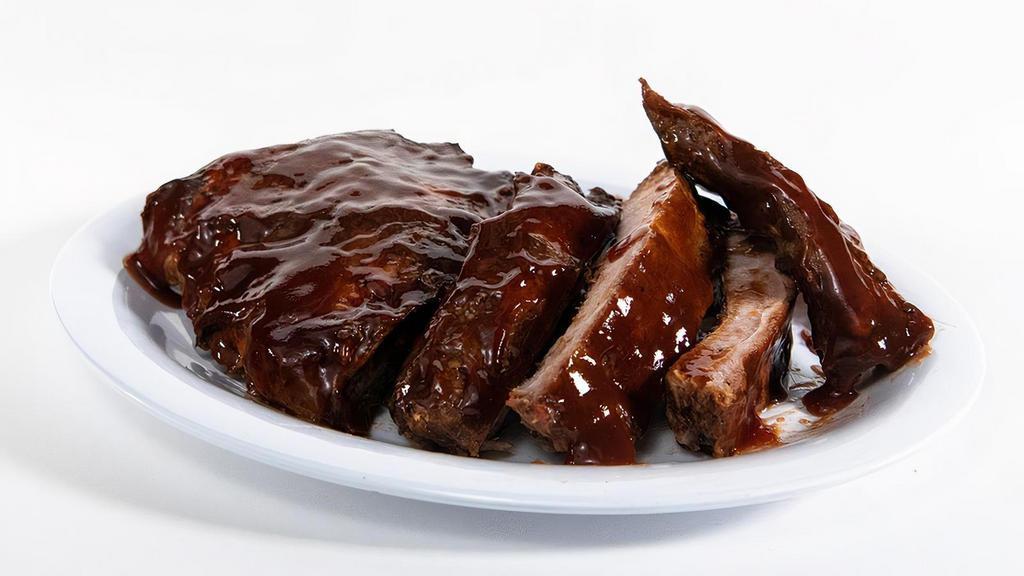 Baby Back Ribs · Savory, slow-cooked, and stick-to-your-ribs delicious. Our baby back ribs are dry-seasoned then brushed with a hickory-smoked BBQ sauce for meat so savory it falls off the bone.