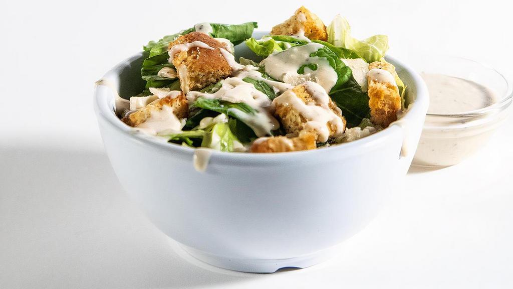 Caesar Salad Side · Get to know the classics. Classic food that is. With crispy romaine, an Italian blend of cheese, croutons, and creamy, classic Caesar dressing, this side dish is downright scholarly.