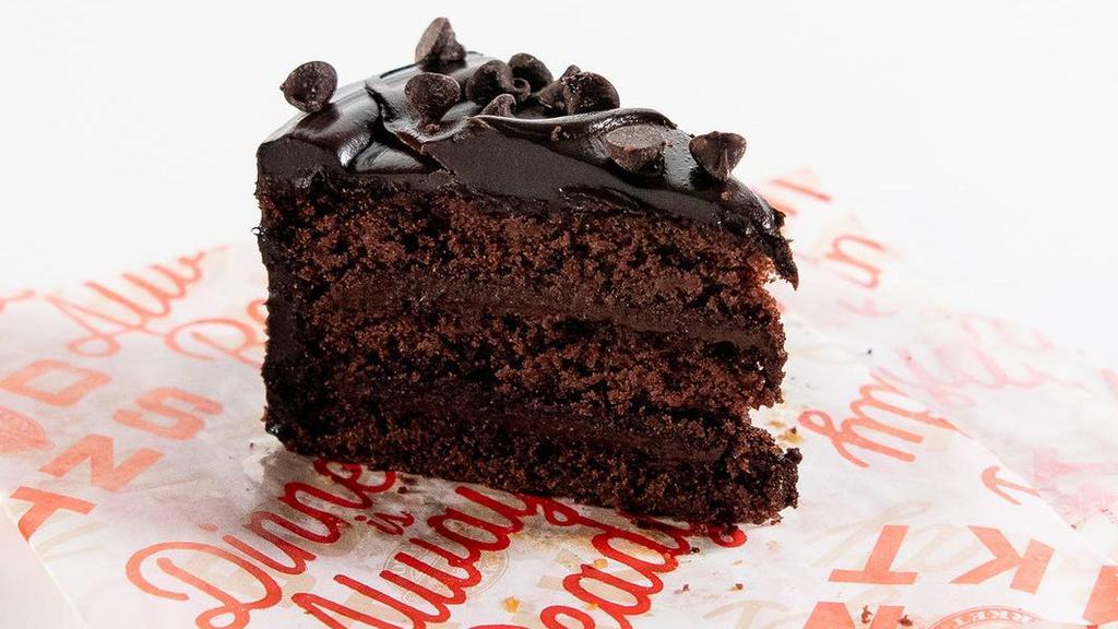 Deluxe Chocolate Cake · Rich chocolate cake covered in velvety chocolate icing sprinkled with chocolate chunks.