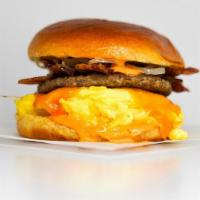 Brioche Big Breakfast Sammy · 2 fresh cracked cage-free scrambled eggs, melted Cheddar cheese, bacon, breakfast sausage, g...