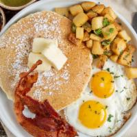 American Breakfast · 2 eggs, 2 mini pancakes, bacon, choice of breakfast potatoes or fruit.