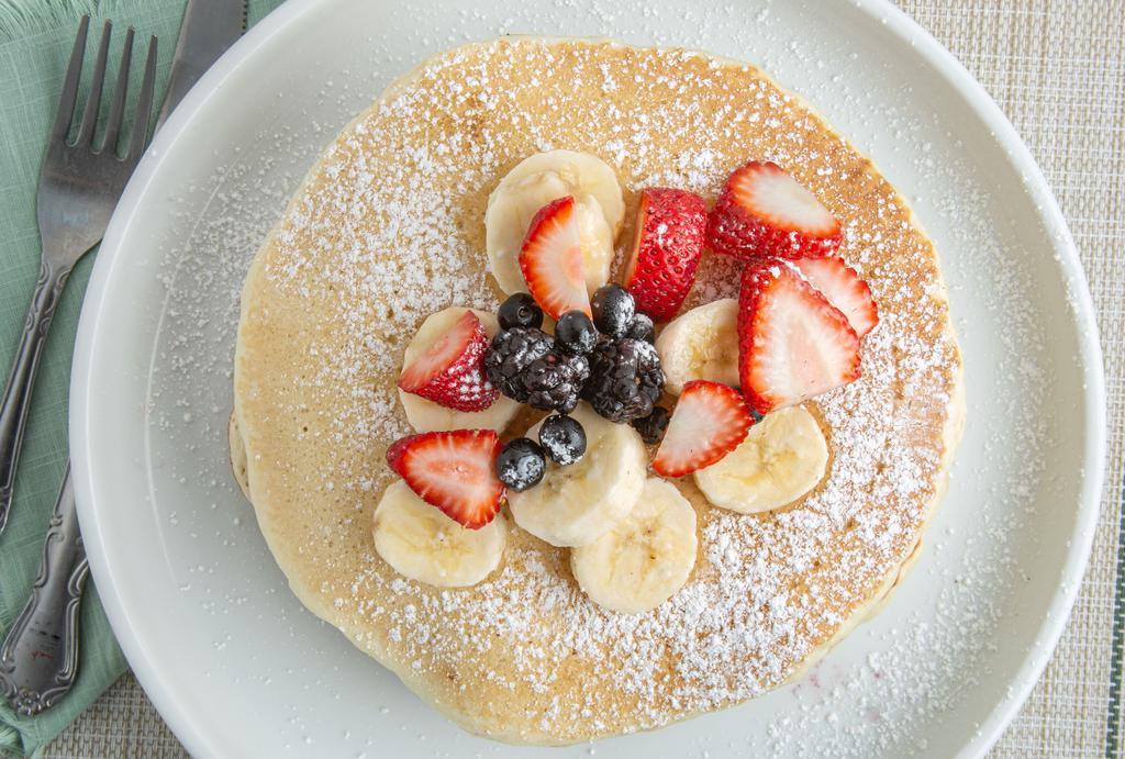 Pancakes · 3 pancakes with choice of toppings (strawberries, bananas, blueberries, or powdered sugar)