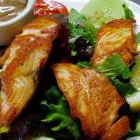 Grilled Salmon Salad · Grilled Salmon on Mixed Greens, Tomatoes and Cucumbers Reduced Oil Balsamic Vinaigrette