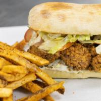 Ain'T Gator Po'Boy · House-made seitan and mushrooms battered and dressed with onions, lettuce, tomatoes, pickles...