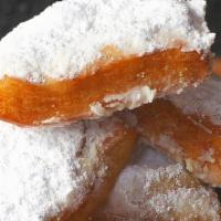 Beignets · A New Orleans staple, these French doughnuts are fluffy pastries of goodness topped with pow...