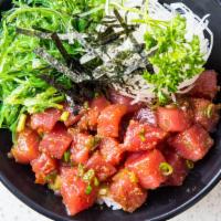 Tuna Poke Bowl · Fresh tuna mixed in a Hawaiian poke dressing topped with green onions, served with seaweed s...