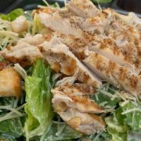 Chicken Caesar Salad · Romaine lettuce, tomato, Caesar dressing, Parmesan cheese, croutons, chicken.