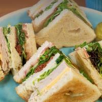 Club Sandwich · White bread, lettuce, American cheese, tomato, turkey, bacon, mayonnaise.