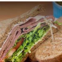 Roast Beef Sandwich · Sourdough bread, roast beef, lettuce, tomato, mayonnaise.